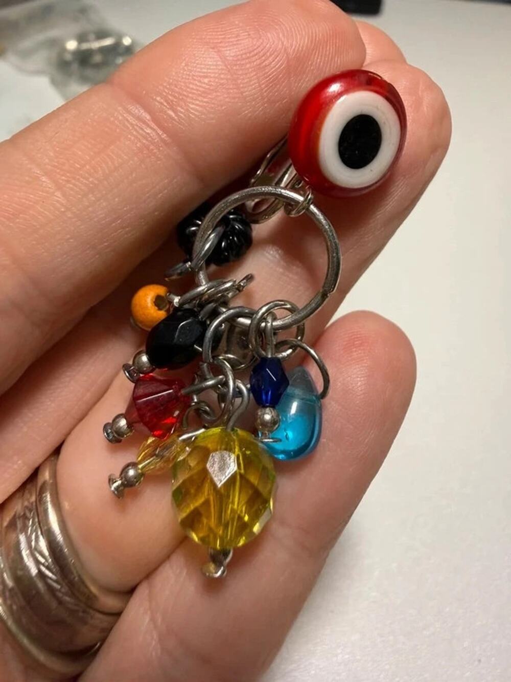 Colorful beaded silver tone evil eye dangle earrings 1.75”
